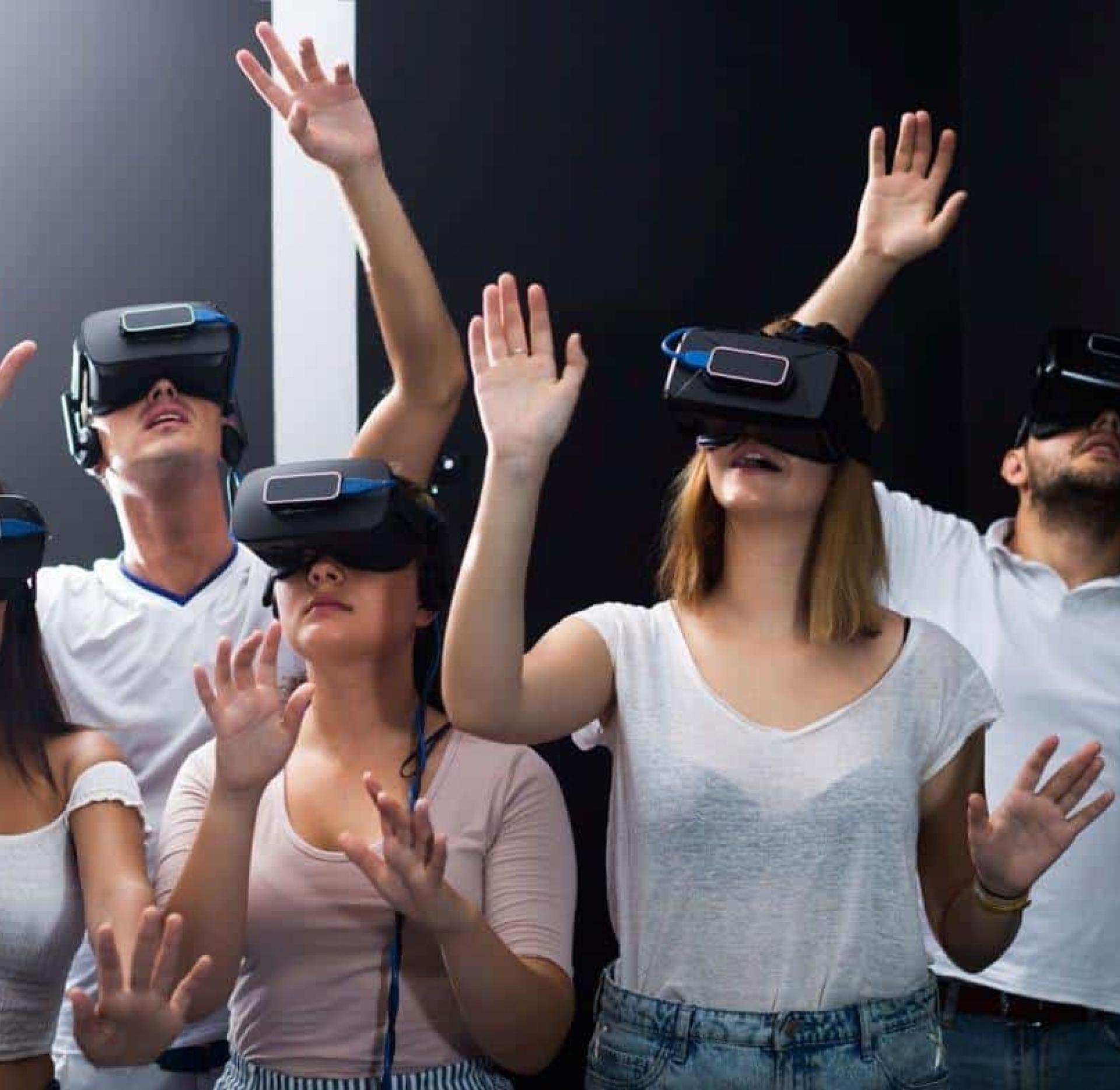 Group wearing VR headsets in a mixed reality experience